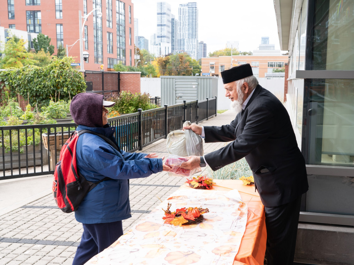 MWC staff hand out food